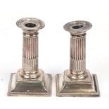 A pair of Victorian silver Mappin & Webb Corinthian column dwarf candlesticks, 1893, 13.5cms (