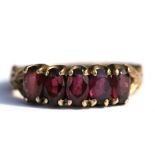 A 9ct gold five-stone garnet ring, approx UK size 'L'.