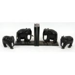 A pair of ebony elephant bookends; together with a pair of ebony elephants (4).