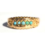 A Victorian 15ct rose gold ring set with five turquoise cabochons, approx UK size 'Q'.