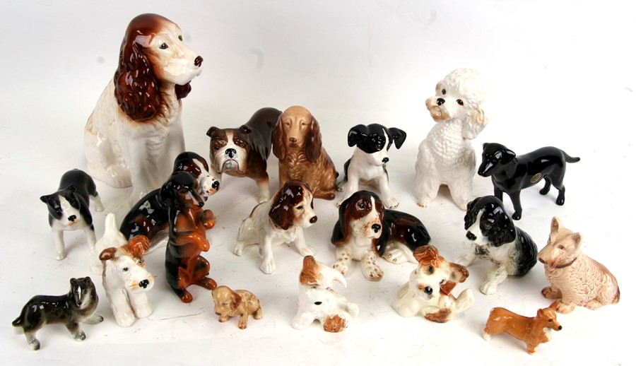 A large quantity of Sylvac dogs to include a large spaniel, numbered 162, and a poodle, numbered