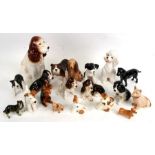A large quantity of Sylvac dogs to include a large spaniel, numbered 162, and a poodle, numbered