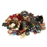 A quantity of ethnic and similar costume jewellery to include jade type beads and necklaces.