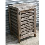 A pine apple chest with seven slides, 55cms (21.5ins) wide.