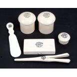 A late 19th century part ivory dressing table set; together with a box, two dome top jars, a