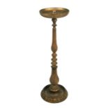 A gilt wood stand on turned column, 89cms (35ins) high.