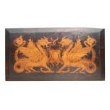 An Art Nouveau wooden panel decorated with a pair of Griffins, 74 by 40cms (29 by 15.75ins).