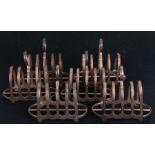 A set of six War Dept. silver plated four division toast racks, the base impressed with Crow's Foot,