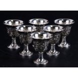 A set of six sterling silver cups with repousse decoration, 189.5g total (6).Condition ReportAll