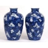 A pair of Chinese prunus cracked ice vases, 27cm (8ins) high (2).Condition ReportMinor glaze