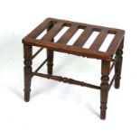 An early 20th century stained beech luggage rack, 56cms (22ins) wide.