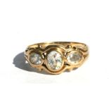A 9ct gold three-stone dress ring, approx UK size 'J'.