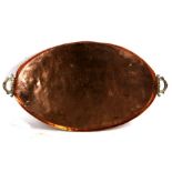 An Arts & Crafts Newlyn school large galleried copper tray with brass carrying handles, 85cms (33.