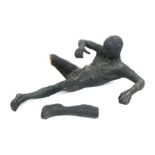 20th century school, a pottery study of a recumbent naked male figure, 46cms (18ins) long.