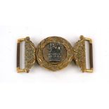 A 19th century silver on gilded brass Army Officers belt buckle in two parts. Each part is numbered: