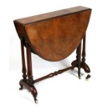 A Victorian figured walnut oval Sutherland table on turned supports, 74cms (29ins) wide.