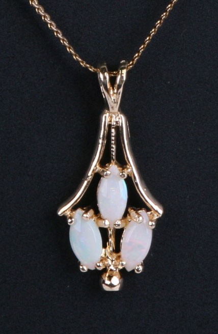 A 14ct gold opal pendant on a 14ct gold chain.Condition ReportOpals good condition with no cracks,