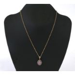 A 9ct gold ruby & diamond pendant on a 9ct gold belcher link chain. 8.8g
