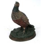 A modern cold painted bronze figure of a grouse. 27cms (10.5ins) high.
