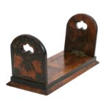 A Victorian walnut extending book trough, 35.5cms (14ins) wide.Condition ReportSome small losses