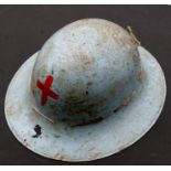 A Zuckerman British WWII Red Cross Civil Defence helmet.