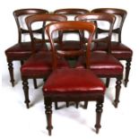 A set of six Victorian mahogany dining chairs with upholstered seats, on turned front supports.