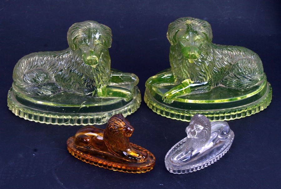 A pair of Victorian pressed uranium glass Newfoundland dogs on plinths, 18cms (7ins) long; together