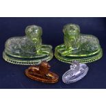 A pair of Victorian pressed uranium glass Newfoundland dogs on plinths, 18cms (7ins) long; together
