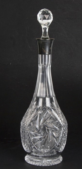 A silver mounted cut glass decanter, 38cms (15ins) high.