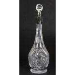 A silver mounted cut glass decanter, 38cms (15ins) high.