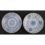 Two Chinese blue & white shallow dishes decorated with flowers, each with blue seal mark to the