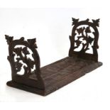 A Black Forest folding book rack, 37cms (14.5ins) wide.