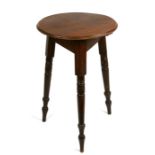 A pine cricket table, 46cms (18ins) diameter.