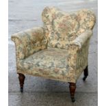 A Howard style upholstered armchair.