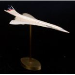 A model of a British Airways Concorde aeroplane on a brass stand, 24cms (9.5ins) long.