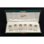 A set of six Henri Pfenninger French silver topped brass pepperettes, cased.