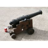 A Cannon, having a cast iron barrel 84cms (33ins) long with an approximate Bore Diameter of 58mm (
