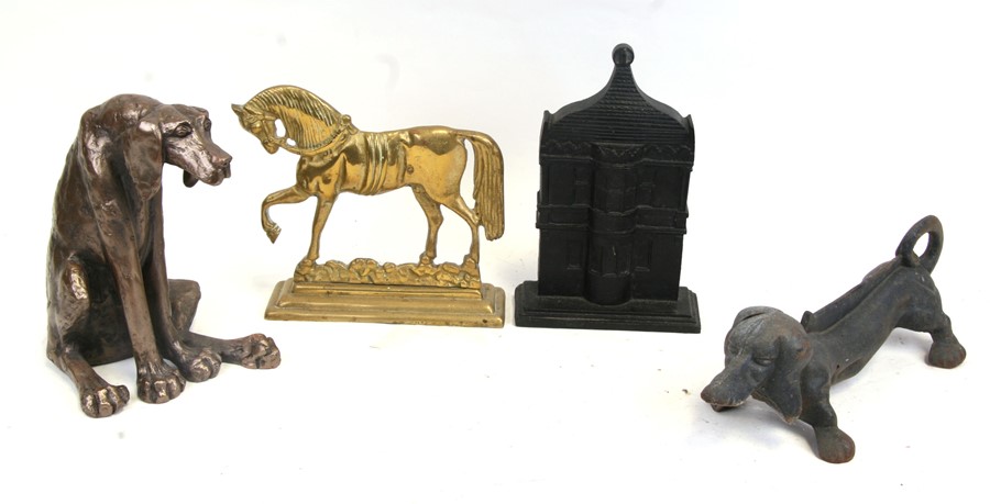A group of door stops to include dogs and horses