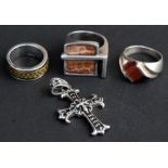 A quantity of silver jewellery to include a tiger's eye ring, two other rings and a cross (4).