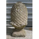 A reconstituted stone pineapple, 42cms (16.5ins) high.
