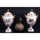 A pair of Coalport Indian Tree Coral pattern two-handled lidded pedestal urns, 17.5cm (7 ins)
