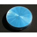 A blue guilloche enamel powder compact with London import marks, 6cms (2.25ins) diameter.