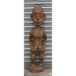 A large African carved wooden fertility figure, 108cms (42.5ins) high.