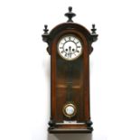 A Vienna style wallclock with 13cm diameter dial with Roman numerals, in a walnut case, 70cm (27.