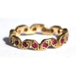 A 9ct gold ruby set eternity ring, approx UK size 'L'.
