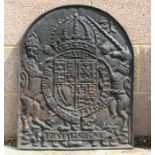 A cast iron fireback decorated with a Royal crest, 54cms (21.25ins) wide.