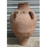 A large two-handled terracotta olive jar, 71cms (28ins) high.