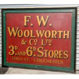 A large painted advertising sign - F W Woolworth & Co. Ltd - 60 Stores High Street, Colchester -