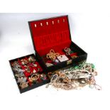 A quantity of costume jewellery in a black jewellery box