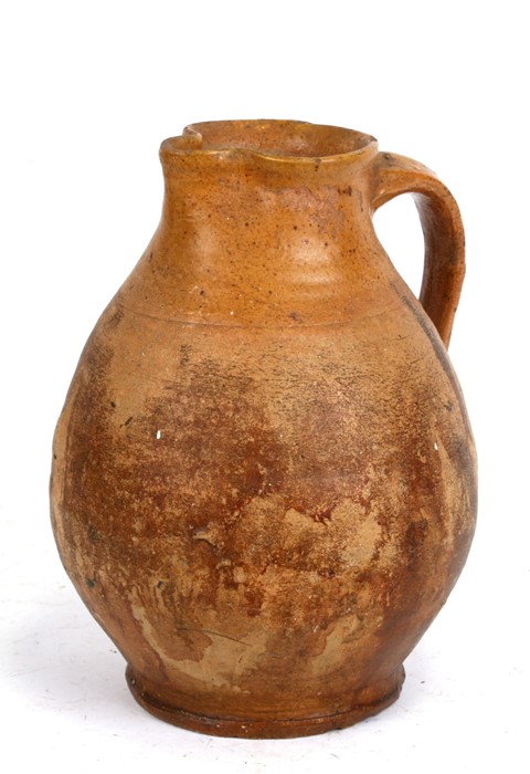 A Verwood Pottery jug, 28cms (11ins) high.